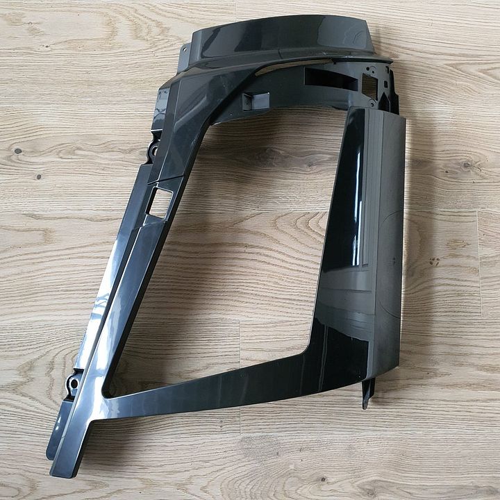 VOLVO FH4 HEADLIGHT COVER PLATE LEFT 21874450