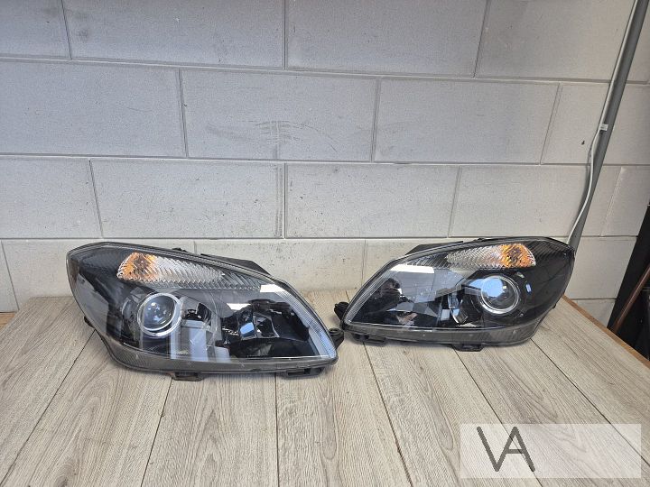 Koplamp set van Skoda Fabia 2010 - 2014 zwart met lens €250